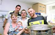 22 September 2014; Callum O'Brien, aged 6 months, with parents Rebecca and Gary meet Kerry players Anthony Maher, left, and Barry John Keane, during a visit by the All Ireland Senior Football Champions 2014 to Our Lady's Children Hospital. Our Lady's Children Hospital, Crumlin, Dublin. Picture credit: Piaras Ó Mídheach / SPORTSFILE