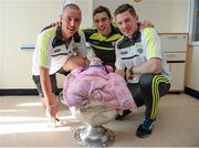 22 September 2014; Gillian O'Donoghue, aged 10 weeks, from Killarney, with Kerry players, from left, Kieran Donaghy, David Moran, and Kieran O'Leary, during a visit by the All Ireland Senior Football Champions 2014 to Our Lady's Children Hospital. Our Lady's Children Hospital, Crumlin, Dublin. Picture credit: Piaras Ó Mídheach / SPORTSFILE