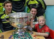 22 September 2014; Abigail Bradshaw, aged 6, from Knocklyon, Dublin, poses for a photograph with the Sam Maguire Cup and Kerry players David Moran, left, and Aidan O'Mahony, during a visit by the All Ireland Senior Football Champions 2014 to Our Lady's Children Hospital. Our Lady's Children Hospital, Crumlin, Dublin. Picture credit: Piaras Ó Mídheach / SPORTSFILE