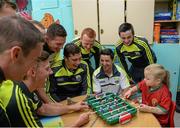22 September 2014; Abigail Bradshaw, aged 6, plays a game of foosball against Kerry's James O'Donoghue, during a visit by the All Ireland Senior Football Champions 2014 to Our Lady's Children Hospital. Our Lady's Children Hospital, Crumlin, Dublin. Picture credit: Piaras Ó Mídheach / SPORTSFILE