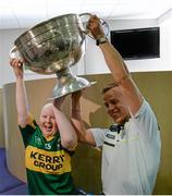 22 September 2014; Rebecca Boyd, aged 14, from Tralee, lifts the Sam Maguire Cup with Kerry's Fionn Fitzgerald, during a visit by the All Ireland Senior Football Champions 2014 to Our Lady's Children Hospital. Our Lady's Children Hospital, Crumlin, Dublin. Picture credit: Piaras Ó Mídheach / SPORTSFILE