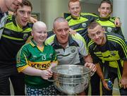 22 September 2014; Rebecca Boyd, aged 14, from Tralee, poses for a photograph with Kerry's Kieran Donaghy and his team-mates, during a visit by the All Ireland Senior Football Champions 2014 to Our Lady's Children Hospital. Our Lady's Children Hospital, Crumlin, Dublin. Picture credit: Piaras Ó Mídheach / SPORTSFILE