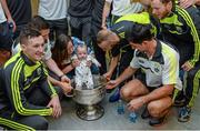 22 September 2014; Ryan Dwhurst, aged 6 months, and his mother Daniele O'Brien, from Killarney, meet Kerry players with the Sam Maguire Cup, during a visit by the All Ireland Senior Football Champions 2014 to Our Lady's Children Hospital. Our Lady's Children Hospital, Crumlin, Dublin. Picture credit: Piaras Ó Mídheach / SPORTSFILE
