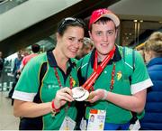 21 September 2014; Team Ireland's Dale Moore, from Dungannon, Co Tyrone, and a member of Armagh Special Olympics Club, with Claire Heffernan, pictured at Dublin Airport on his return from the 2014 Special Olympics European Games in Antwerp, Belgium. Dublin Airport, Dublin. Picture credit: Tomás Greally / SPORTSFILE