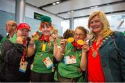 21 September 2014; Team Ireland, pictured at Dublin Airport, from left: Paul Gordon, from Omagh, Co Tyrone, and a member of Star Breakers Special Olympics Club; Sarah Kilmartin, from Clonbonny, Athlone, and a member of  Athlone Special Olympics Club; and Mary O'Brien, from Duncormick, Co.Wexford, on their return from the 2014 Special Olympics European Games in Antwerp, Belgium. Dublin Airport, Dublin. Picture credit: Tomás Greally / SPORTSFILE