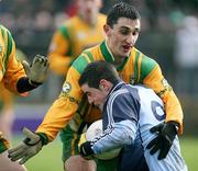 25 February 2007; Paddy Campbell, Donegal, getting to grips with Ross McConnell, Dublin. Allianz National Football League, Division 1A, Round 3, Donegal v Dublin, Fr. Tierney Park, Ballyshannon, Co. Donegal. Picture Credit: Oliver McVeigh / SPORTSFILE