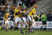 25 February 2007; Eoin Larkin, Kilkenny, in action against Clive Lawlor, left, and Paul Roche, Wexford. Walsh Cup Hurling Final, Wexford v Kilkenny, Wexford Park, Weford. Picture Credit: Ray McManus / SPORTSFILE