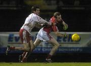 24 February 2007; Ger Spillane, Cork, in action against Justin McMahon, Tyrone. Allianz National Football League, Division 1A, Round 3, Cork v Tyrone, Pairc Ui Rinn, Cork. Picture Credit: Pat Murphy / SPORTSFILE