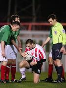 26 February 2007; Glentorans Jason Hill and Kyle Neill watch on as referee Brian Turkington check on Kevin Deery, Derry City. Setanta Cup Group 1, Glentoran v Derry City, The Oval, Belfast, Co. Antrim. Picture credit: Russell Pritchard / SPORTSFILE
