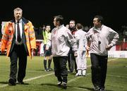 26 February 2007; Security escorts Derry City manager Pat Fenlon while referee Brian Turkington points in the background. Setanta Cup Group 1, Glentoran v Derry City, The Oval, Belfast, Co. Antrim. Picture credit: Russell Pritchard / SPORTSFILE
