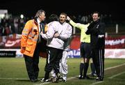 26 February 2007; Security restrains Derry City manager Pat Fenlon from Glentorans assistant manager Alan McDonald. Setanta Cup Group 1, Glentoran v Derry City, The Oval, Belfast, Co. Antrim. Picture credit: Russell Pritchard / SPORTSFILE