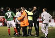 26 February 2007; Glentorans Gary Hamilton watches as security restrains Derry City manager Pat Fenlon from Glentorans assistant manager Alan McDonald. Setanta Cup Group 1, Glentoran v Derry City, The Oval, Belfast, Co. Antrim. Picture credit: Russell Pritchard / SPORTSFILE