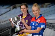 23 September 2014; In attendence at a photocall ahead of the TG4 All-Ireland Junior, Intermediate and Senior Ladies Football Championship Finals on Sunday next, are, Junior Finalists Clara Donnelly, left, Wexford, and Alisha Jordan, New York, with the West County Hotel Cup. Croke Park, Dublin. Picture credit: Brendan Moran / SPORTSFILE