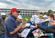 23 September 2014; Phil Mickelson, Team USA, signs autographs after finishing his practice round on the 18th green during the USA teams practice. Previews of the 2014 Ryder Cup Matches. Gleneagles, Scotland. Picture credit: Matt Browne / SPORTSFILE