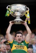 21 September 2014; Kerry's Aidan O'Mahony lifts the Sam Maguire cup. GAA Football All Ireland Senior Championship Final, Kerry v Donegal. Croke Park, Dublin. Picture credit: Stephen McCarthy / SPORTSFILE