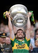 21 September 2014; Kerry's Killian Young lifts the Sam Maguire cup. GAA Football All Ireland Senior Championship Final, Kerry v Donegal. Croke Park, Dublin. Picture credit: Stephen McCarthy / SPORTSFILE