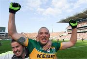 21 September 2014; Kieran Donaghy, Kerry, celebrates his side's victory with water carrier Eddie Walsh. GAA Football All Ireland Senior Championship Final, Kerry v Donegal. Croke Park, Dublin. Picture credit: Stephen McCarthy / SPORTSFILE