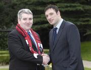 26 February 2007; Patrick Collum, left, Longford Town, is congratulated on his appointment by Noel Mooney, recently appointed as the FAI's National Coordinator of the Club Promotion Officers Programme, at the launch of the Football Association of Ireland Club Promotions Officers. The Club Promotions Officers Programme is a new development within the eircom League of Ireland. Fifteen clubs have appointed a Club Promotion Officer, whose role it will be to strengthen links between the club and the local community. Radisson SAS St. Helen's Hotel, Stillorgan, Dublin. Picture credit: Ray McManus / SPORTSFILE