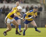 4 March 2007; Niall Gilligan, Clare, in action against David O'Connor, Wexford. Allianz National Hurling League, Division 1A Round 2, Clare v Wexford, Cusack Park, Ennis, Co. Clare. Picture credit: Ray McManus / SPORTSFILE