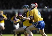 4 March 2007; Paul Carley, Wexford, in action against Kevin Dilleen, Clare. Allianz National Hurling League, Division 1A Round 2, Clare v Wexford, Cusack Park, Ennis, Co. Clare. Picture credit: Ray McManus / SPORTSFILE