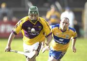 4 March 2007; Keith Rossiter, Wexford, in action against Colin Lynch, Clare. Allianz National Hurling League, Division 1A Round 2, Clare v Wexford, Cusack Park, Ennis, Co. Clare. Picture credit: Ray McManus / SPORTSFILE