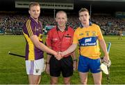 13 September 2014; Wexford captain Shane O'Gorman and Clare captain Tony Kelly shake hands across referee Cathal McAllister. Bord Gáis Energy GAA Hurling Under 21 All-Ireland 'A' Championship Final, Clare v Wexford. Semple Stadium, Thurles, Co. Tipperary. Picture credit: Ray McManus / SPORTSFILE