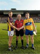 13 September 2014; Wexford captain Shane O'Gorman and Clare captain Tony Kelly shake hands across referee Cathal McAllister. Bord Gáis Energy GAA Hurling Under 21 All-Ireland 'A' Championship Final, Clare v Wexford. Semple Stadium, Thurles, Co. Tipperary. Picture credit: Ray McManus / SPORTSFILE