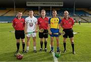 13 September 2014; The Kildare captain, Gerry Keegan, and the Roscommon captain, Hugh Rooney, shake hands accross referee Owen Elliott, with linesmen John Keane, left, and Justin Heffernan, before the toss.  Bord Gáis Energy GAA Hurling Under 21 All-Ireland 'B' Championship Final, Roscommon v Kildare. Semple Stadium, Thurles, Co. Tipperary. Picture credit: Ray McManus / SPORTSFILE