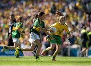 21 September 2014; Molly Cummins, Cappawhite NS, Co. Tipperary, representing Kerry, in action against Katie Teague, St Colmcille’s PS, Co, Derry, representing Donegal, during the INTO/RESPECT Exhibition GoGames. Croke Park, Dublin. Picture credit: Ray McManus / SPORTSFILE