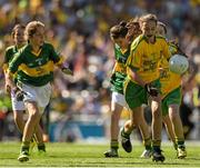 21 September 2014; Megan Delaney, Bekan PS, Co. Mayo, representing Donegal, in action against Mary Ni Chonaill, Gaelscoil Mhic Easmainn, Co Kerry, representing Kerry, during the INTO/RESPECT Exhibition GoGames. Croke Park, Dublin. Picture credit: Ray McManus / SPORTSFILE