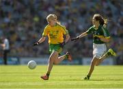 21 September 2014; Leah Brady, St Mary’s NS, Co. Cavan, representing Donegal, in action against Mary Ni Chonaill, Gaelscoil Mhic Easmainn, Co Kerry, representing Kerryl, during the INTO/RESPECT Exhibition GoGames. Croke Park, Dublin. Picture credit: Ray McManus / SPORTSFILE