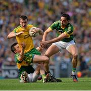 21 September 2014; Leo McLoone, Donegal, in action against Paul Murphy, left, and Anthony Maher, Kerry. GAA Football All Ireland Senior Championship Final, Kerry v Donegal. Croke Park, Dublin. Picture credit: Piaras Ó Mídheach / SPORTSFILE