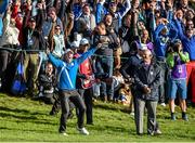 26 September 2014; Rory McIlroy, Team Europe, celebrates after Sergio Garcia played his second shot from the bunker into the hole for a birdie. The 2014 Ryder Cup, Day 1. Gleneagles, Scotland. Picture credit: Matt Browne / SPORTSFILE
