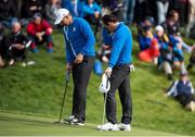 26 September 2014; Rory McIlroy and Sergio Garcia, Team Europe, on the 18th green after losing the match to Phil Mickelson and Keegan Bradley, during the Morning Fourball Matches. The 2014 Ryder Cup, Day 1. Gleneagles, Scotland. Picture credit: Matt Browne / SPORTSFILE