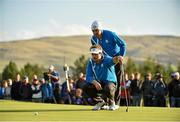 26 September 2014; Victor Dubuisson and team-mate Graeme McDowell, Team Europe, line up a putt on the 14th green during the Afternoon Foursomes Match against Phil Mickelson and Keegan Bradley. The 2014 Ryder Cup, Day 1. Gleneagles, Scotland. Picture credit: Matt Browne / SPORTSFILE