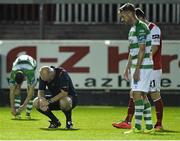 26 September 2014; Referee Tom Connolly takes a moment to recover after receiving a knock. SSE Airtricity League Premier Division, St Patrick's Athletic v Shamrock Rovers, Richmond Park, Dublin. Picture credit: David Maher / SPORTSFILE
