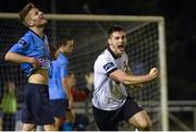 26 September 2014; Patrick Hoban, Dundalk, celebrates after scoring his side's second goal as UCD's Colm Crowe shows his disappointment. SSE Airtricity League Premier Division, UCD v Dundalk, Belfield Bowl, UCD, Belfield, Dublin. Picture credit: Pat Murphy / SPORTSFILE