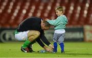 26 September 2014; Cork City's Dan Murray ties the boot laces of his son, Caleb Murray, aged 4, after the game. SSE Airtricity League Premier Division, Cork City v Sligo Rovers. Turner's Cross, Cork. Picture credit: Diarmuid Greene / SPORTSFILE