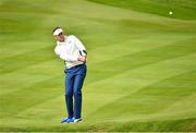 27 September 2014; Ian Poulter, Team Europe, watches his chipp that went into the hole for a birdie on the 15th green during the morning Fourball Match against Jimmy Walker and Rickie Fowler, Team USA. The 2014 Ryder Cup, Day 2. Gleneagles, Scotland. Picture credit: Matt Browne / SPORTSFILE
