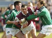 7 March 2004; Damien Burke of Galway in action against Conor Mullane, left, and Damien Reidy of Limerick during the Allianz Football League Division 1B Round 4 match between Galway and Limerick at Duggan Park in Ballinasloe, Galway. Photo by Pat Murphy/Sportsfile