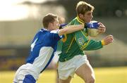 7 March 2004; Brian Farrell of Meath is tackled by Tom McDonald of Laois during the Allianz Football League Division 1B Round 4 match between Laois and Meath at O'Moore Park in Portlaoise, Laois. Photo by Matt Browne/Sportsfile
