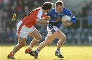 7 March 2004; Jason Reilly of Cavan in action against Enda McNulty of Armagh during the Allianz Football League Division 1B Round 4 match between Cavan and Armagh at Breffni Park in Cavan. Photo by David Maher/Sportsfile