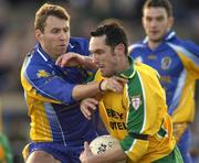 7 March 2004; Brendan Devenney of Donegal in action against Michael Ryan of Roscommon during the Allianz Football League Division 2A Round 4 match between Roscommon and Donegal at Dr. Hyde Park in Roscommon. Photo by Damien Eagers/Sportsfile