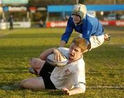 8 March 2004; Jason Harris Wright of Pres Bray goes over for his side's second try despite the efforts of Nick Croke of St. Mary's College during the Leinster Schools Junior Cup Semi-Final match between Pres Bray and St. Mary's College at Donnybrook Stadium in Dublin. Photo by Damien Eagers/Sportsfile