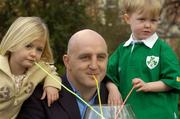 9 March 2004; Former Ireland International Rugby captain Keith Wood with 5 year old Rebecca Johnston, from Arklow, and 4 year old Kealan Quinn, from Kimmage, at the launch of Dawn Omega Milk at St. Stephen's Green in Dublin. Photo by Brian Lawless/Sportsfile
