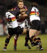 12 March 2004; Shaun Payne of Munster in action against Sione Tuipulota, 15, and Hal Luscombe of Newport Gwent Dragons during the Celtic League Division 1 match between Munster and Newport Gwent Dragons at Thomond Park in Limerick. Photo by Damien Eagers/Sportsfile