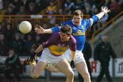 14 March 2004; Darragh Breen of Wexford in action against Larry Reilly of Cavan during the Allianz Football League Division 1B Round 5 match between Wexford and Cavan at Wexford Park in Wexford. Photo by Pat Murphy/Sportsfile