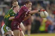 14 March 2004; John Keane of Westmeath in action against Mike Frank Russell of Kerry during the Allianz Football League Division 1A Round 5 match between Westmeath and Kerry at Cusack Park in Mullingar, Westmeath. Photo by Matt Browne/Sportsfile
