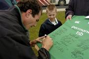 16 March 2004; Girvan Dempsey signs a jersey for 8 year old Dylan Kelso, from Tullamore, Co. Offaly, following an Ireland Rugby Squad Training at Naas Rugby Club in Naas, Kildare. Photo by Matt Browne/Sportsfile