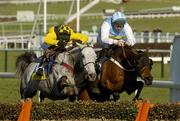 16 March 2004; Hardy Eustace, right, with Conor O'Dwyer up, jumps the last alongside eventual second place finisher Rooster Brooster, with Richard Johnson up, on their way to winning the Smurfit Champion Hurdle Challenge Trophy during Day One of the Cheltenham Racing Festival at Prestbury Park in Cheltenham, England. Photo by Pat Murphy/Sportsfile